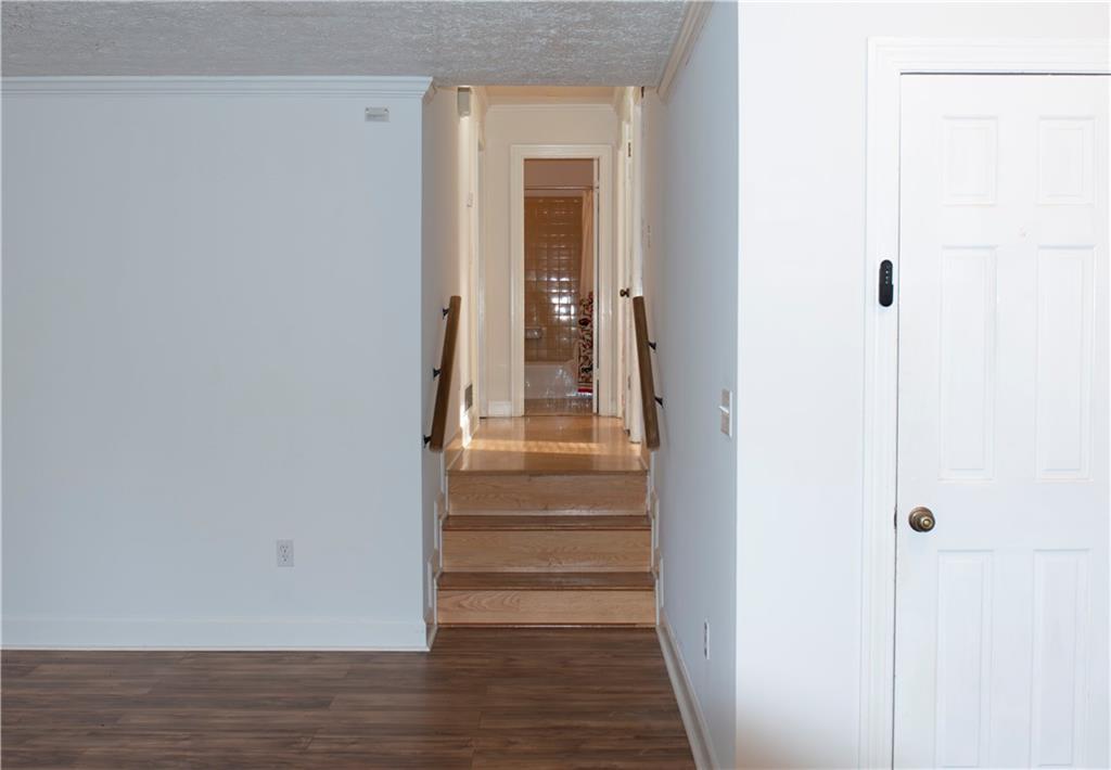 3626 Thompson Bend Gainesville, GA 30506 - Photo 7 of 14 a view of a hallway with wooden floor and entryway