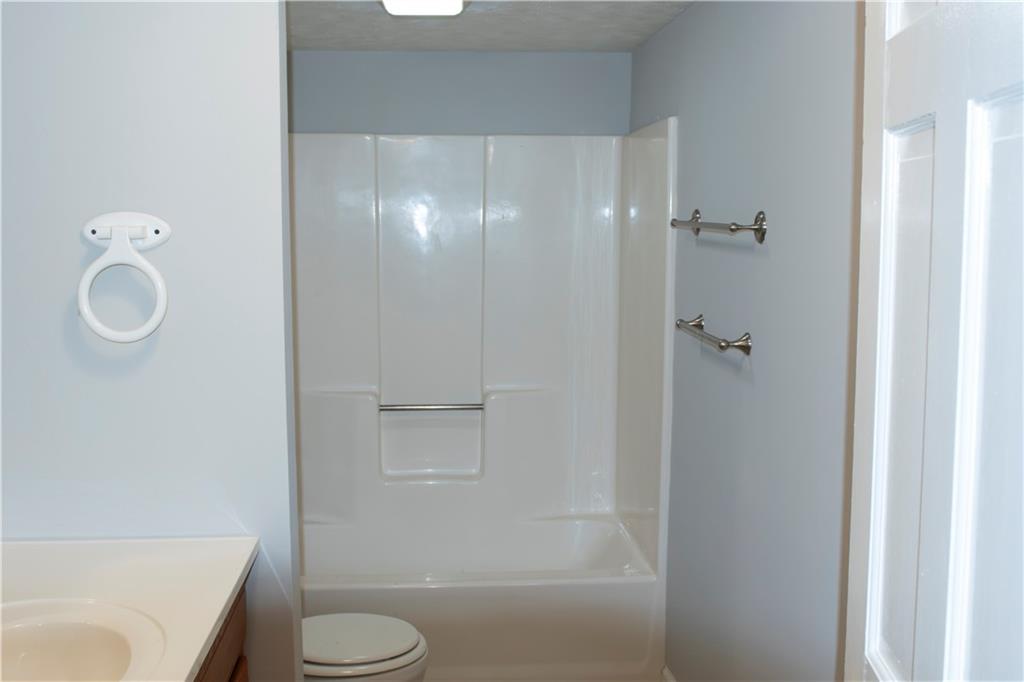 3626 Thompson Bend Gainesville, GA 30506 - Photo 9 of 14 a bathroom with a granite countertop toilet and a sink