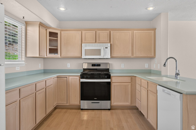 1305 Alpine Way Provo, UT 84606 - Photo 20 of 56 U-shaped kitchen with light wood-finish cabinetry