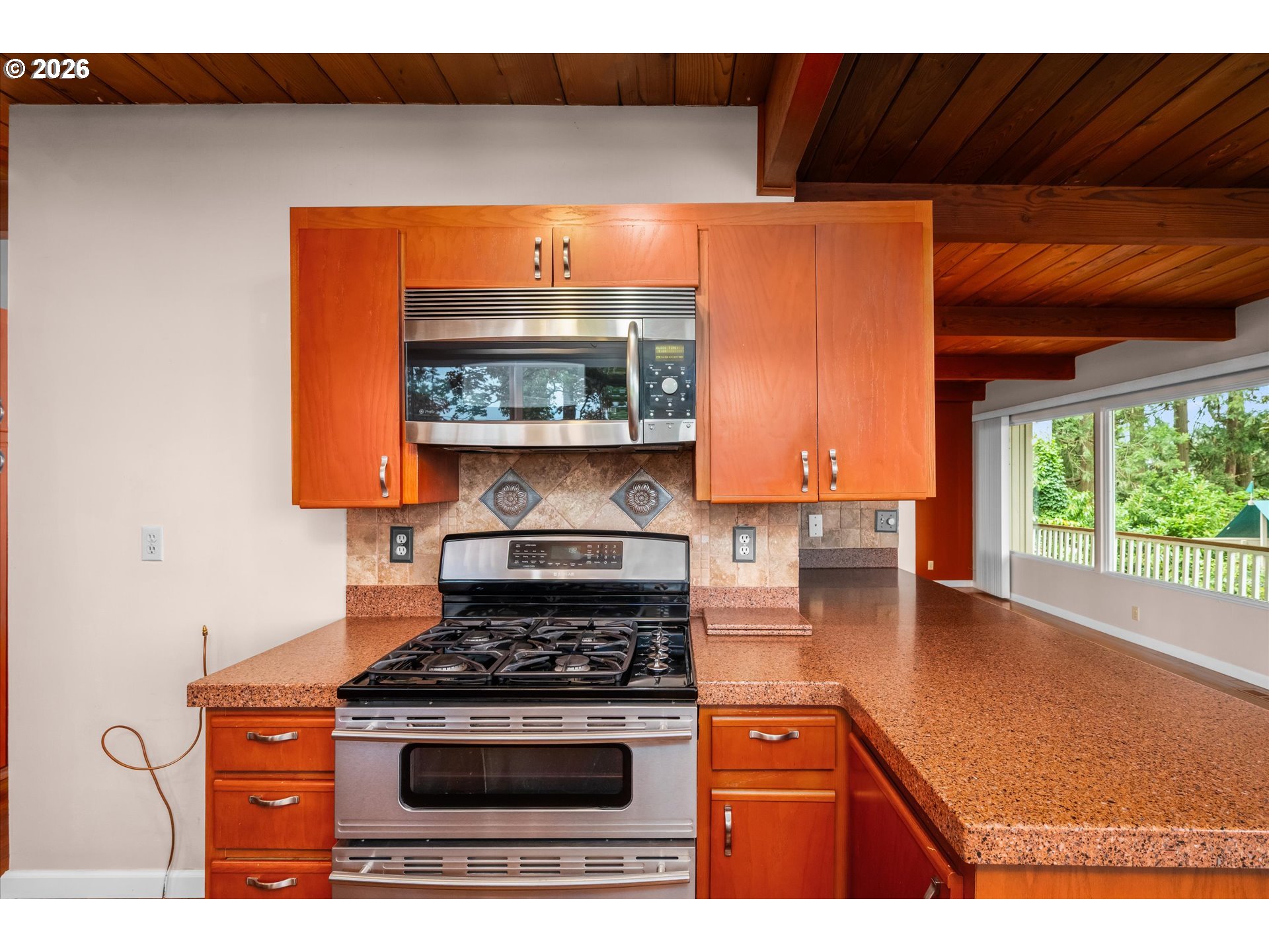 2012 Greiner Street Eugene, OR 97405 - Photo 15 of 45 a kitchen with a stove and a microwave