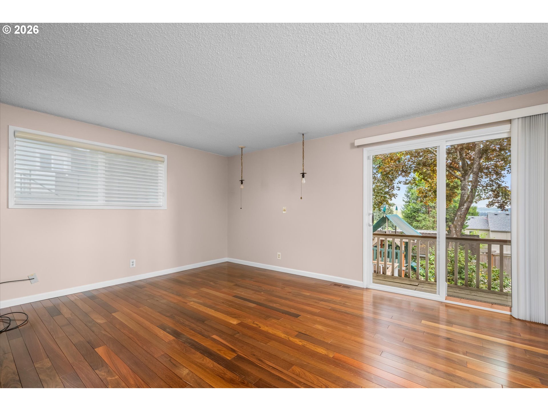 2012 Greiner Street Eugene, OR 97405 - Photo 17 of 45 an empty room with wooden floor and windows