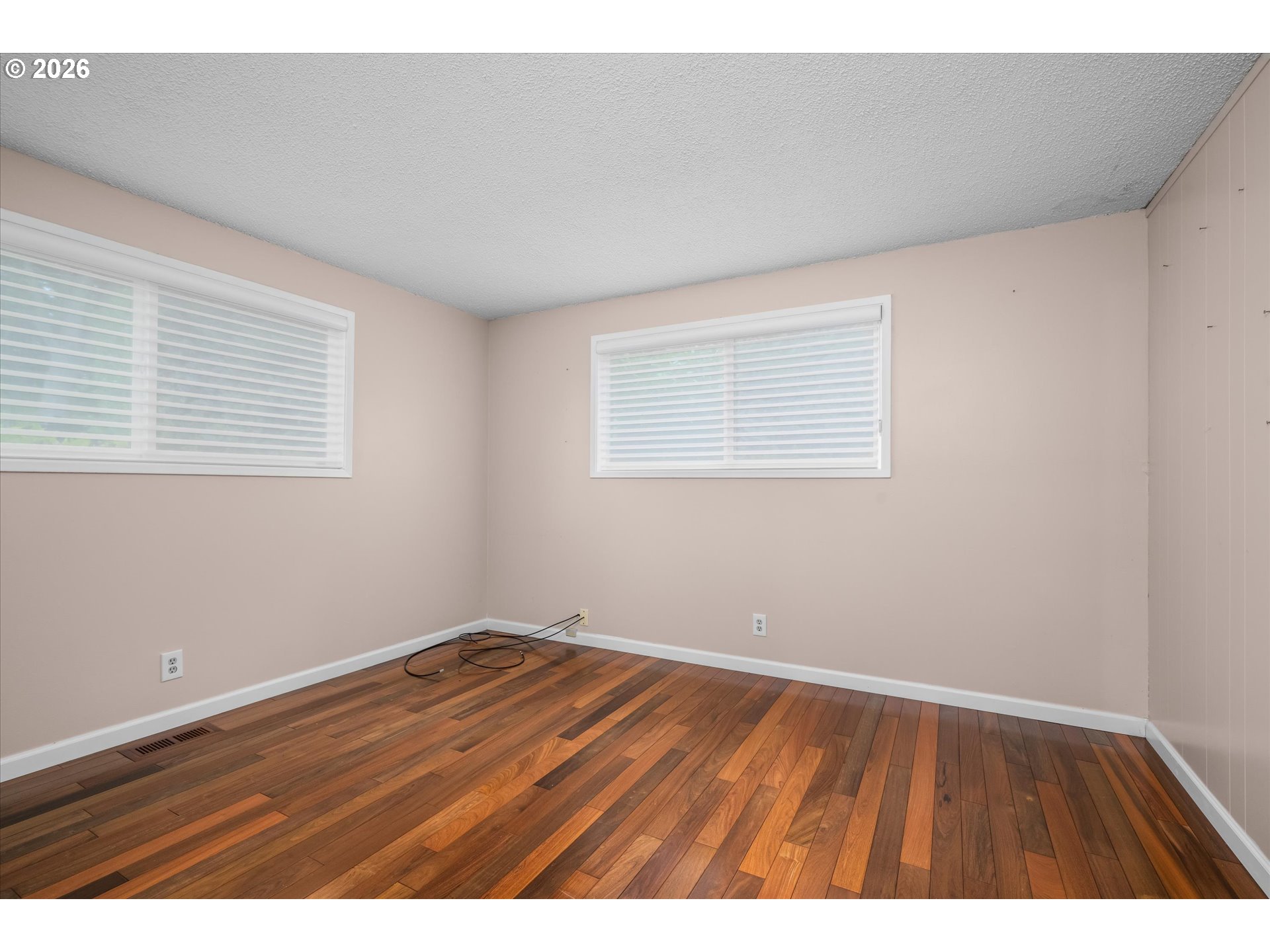 2012 Greiner Street Eugene, OR 97405 - Photo 20 of 45 an empty room with wooden floor and windows