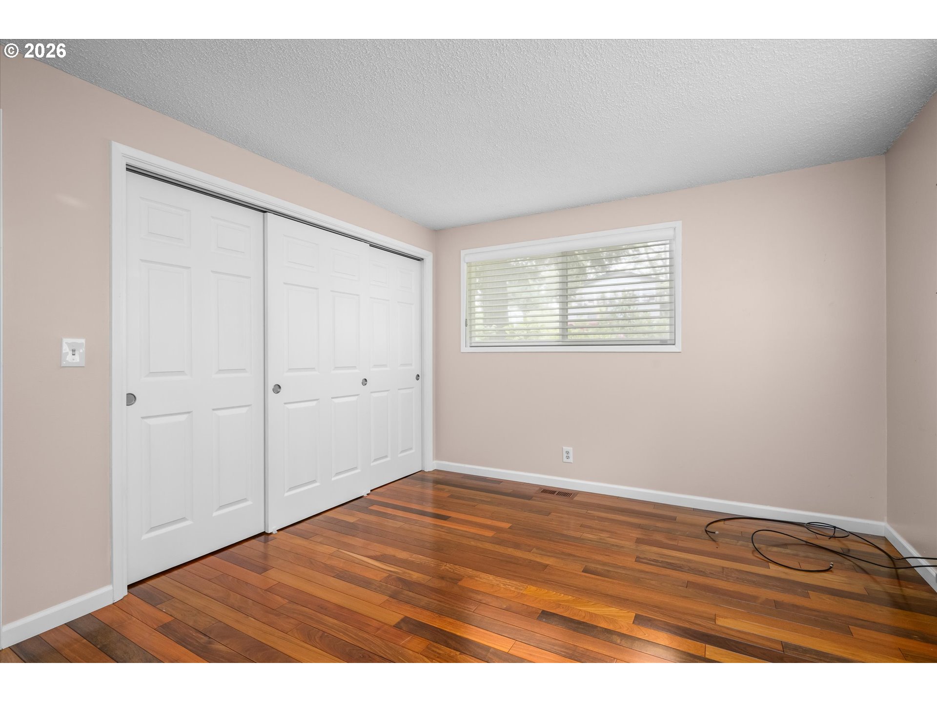 2012 Greiner Street Eugene, OR 97405 - Photo 21 of 45 a view of an empty room with wooden floor and a window