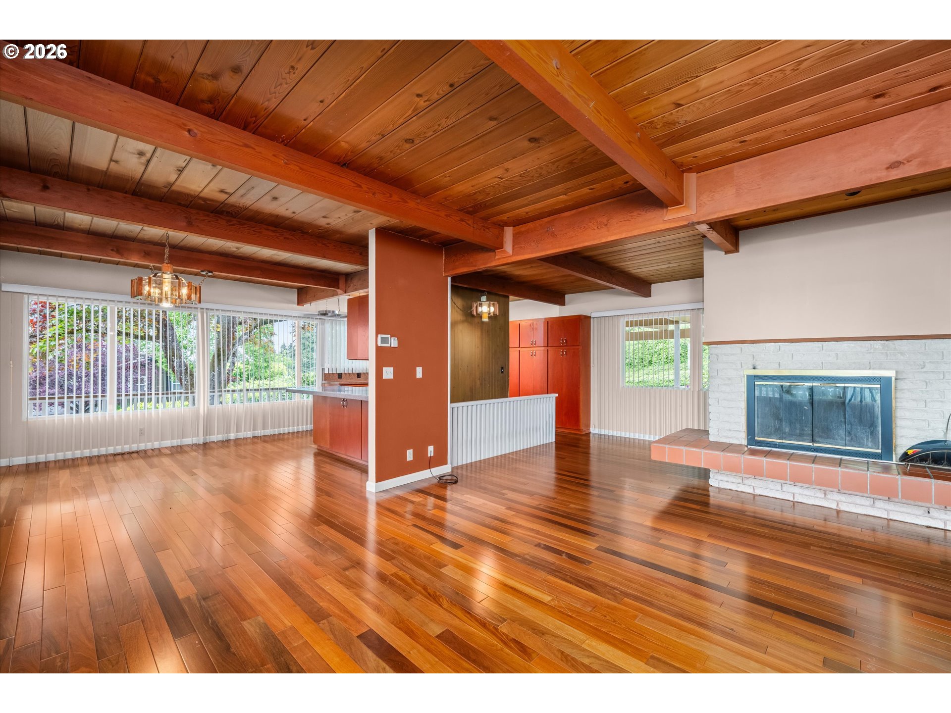 2012 Greiner Street Eugene, OR 97405 - Photo 5 of 45 a view of empty room with wooden floor and fireplace