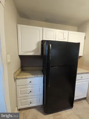 a kitchen with appliances and cabinets