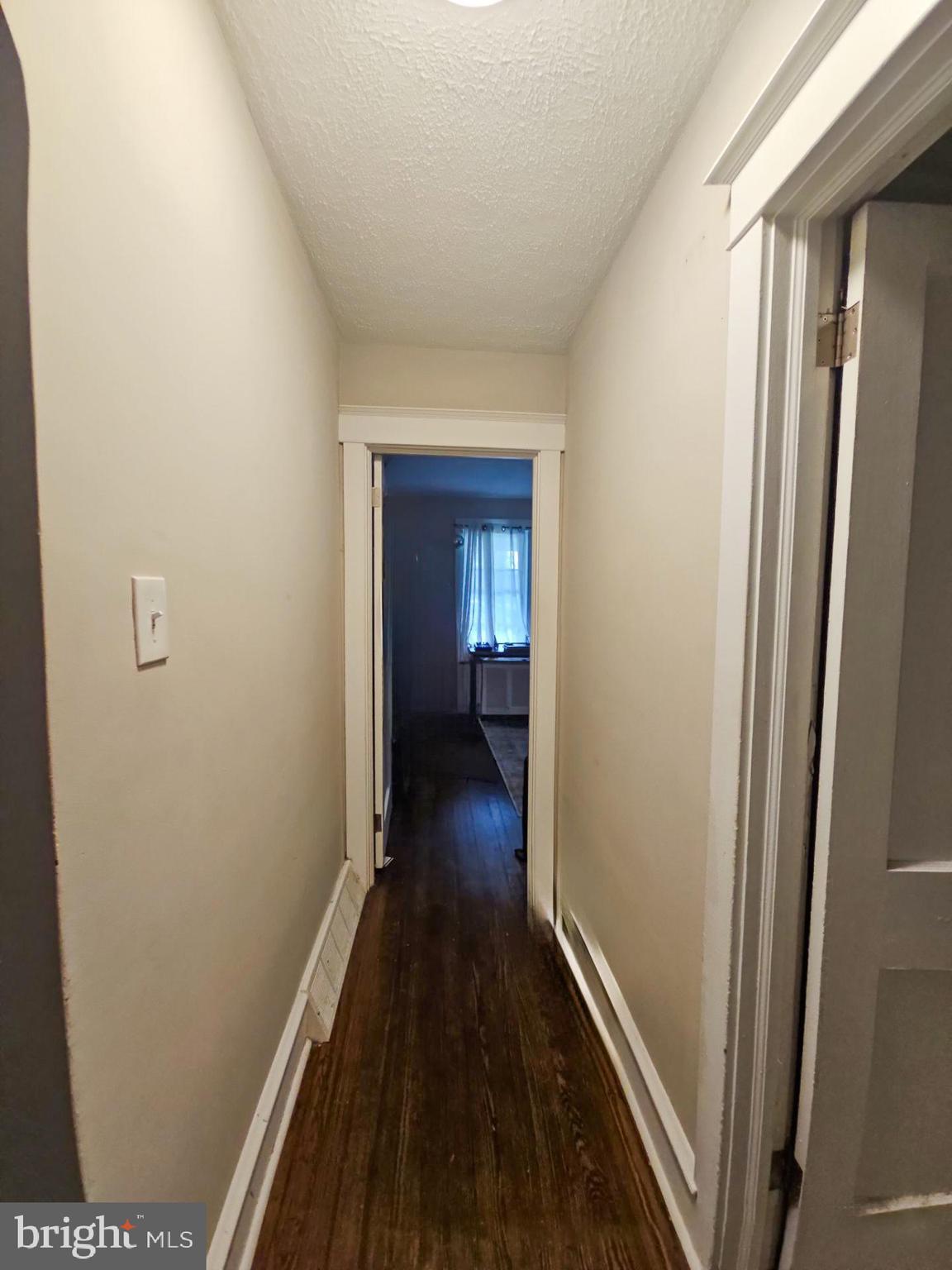 279 Logwood Avenue Carneys Point, NJ 08069 - Photo 6 of 7 a view of a hallway with wooden floor
