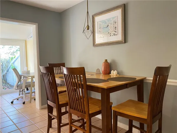 a kitchen with granite countertop white cabinets stainless steel appliances and sink