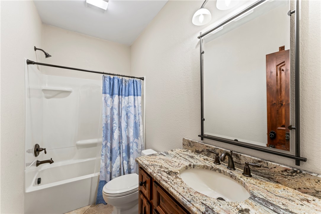 579 Terrapin Crossing Road Pickens, SC 29671 - Photo 26 of 50 Granite counters and tile flooring highlight this well-appointed hall bathroom.
