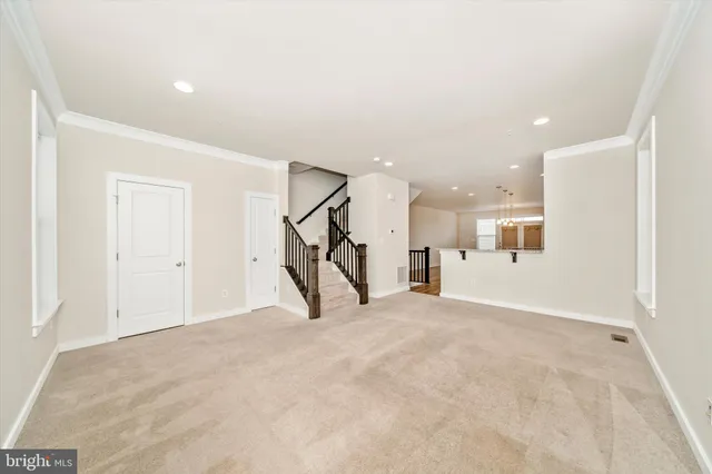 a kitchen with kitchen island granite countertop a sink appliances and cabinets