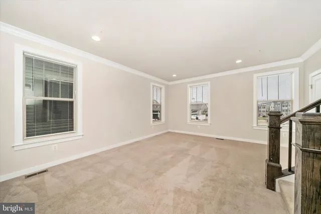 a kitchen with stainless steel appliances granite countertop a lot of counter space and wooden floors