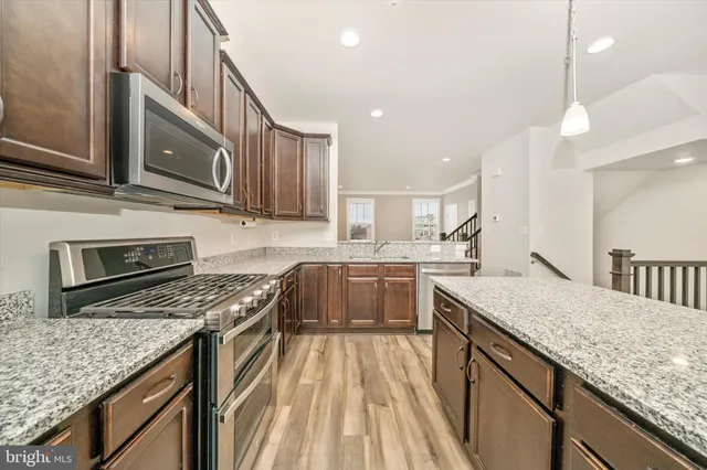 a view of a livingroom with furniture and wooden floor