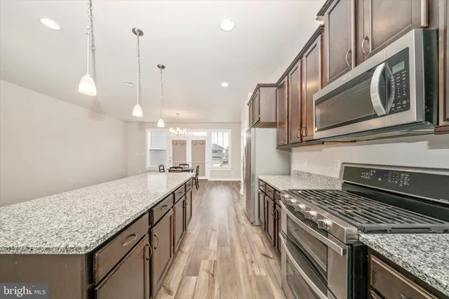 a bathroom with a sink a mirror and a vanity