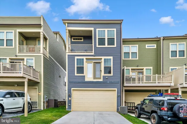 a view of a brick house with a garage