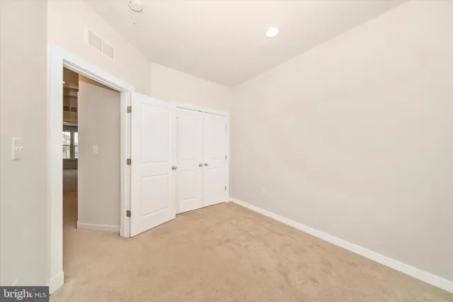 a view of a house with a yard and plants