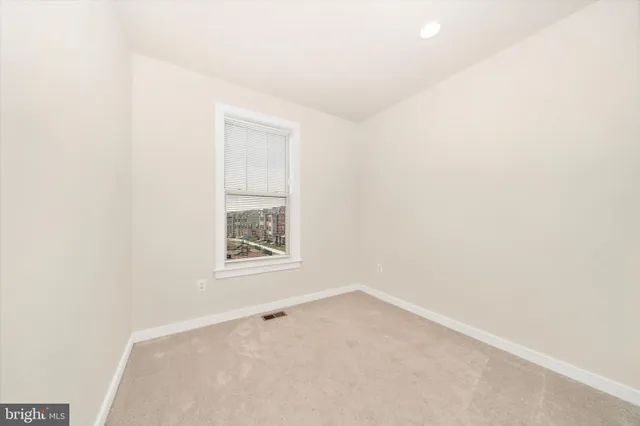 an outdoor space with furniture and umbrella