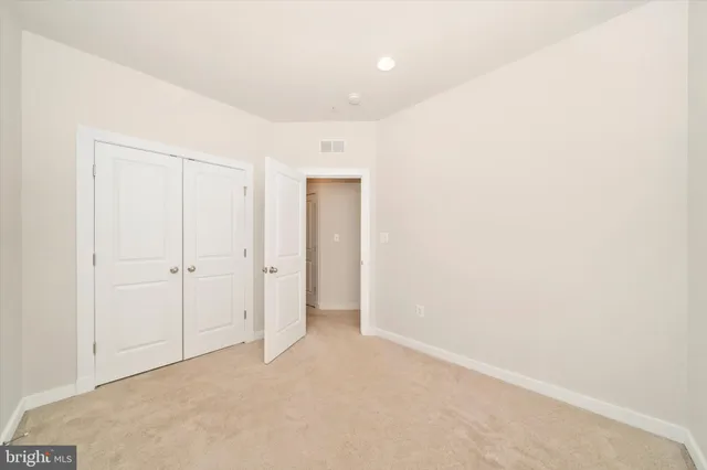 a view of a backyard with plants and patio