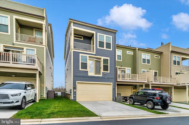 a view of a water with palm trees
