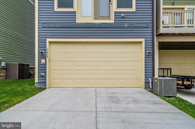 a large kitchen with stainless steel appliances kitchen island granite countertop a large counter top a stove a sink and a refrigerator