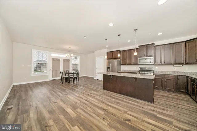 a open kitchen with a table and chairs in it