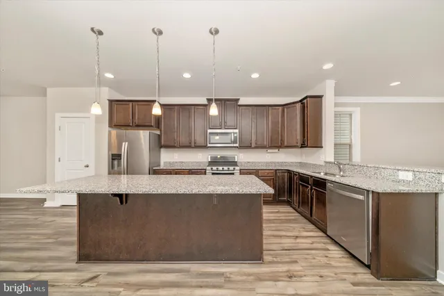 a view of livingroom with stairs and a window