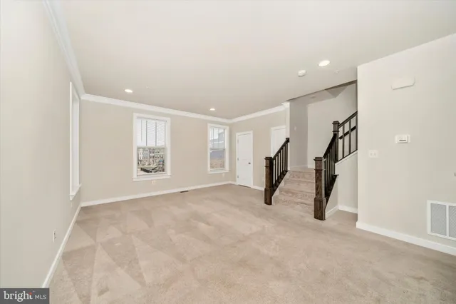 a kitchen with stainless steel appliances granite countertop a sink refrigerator and cabinets