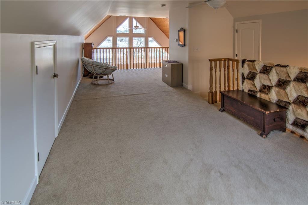 198 Shoreline Road New London, NC 28127 - Photo 16 of 28 Large combination bedroom loft with sitting area and gorgeous view of the lake.
