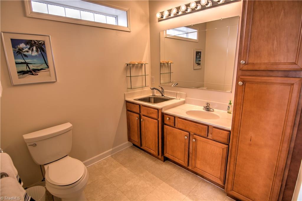 198 Shoreline Road New London, NC 28127 - Photo 26 of 28 Full bath on lower level with utility sink.