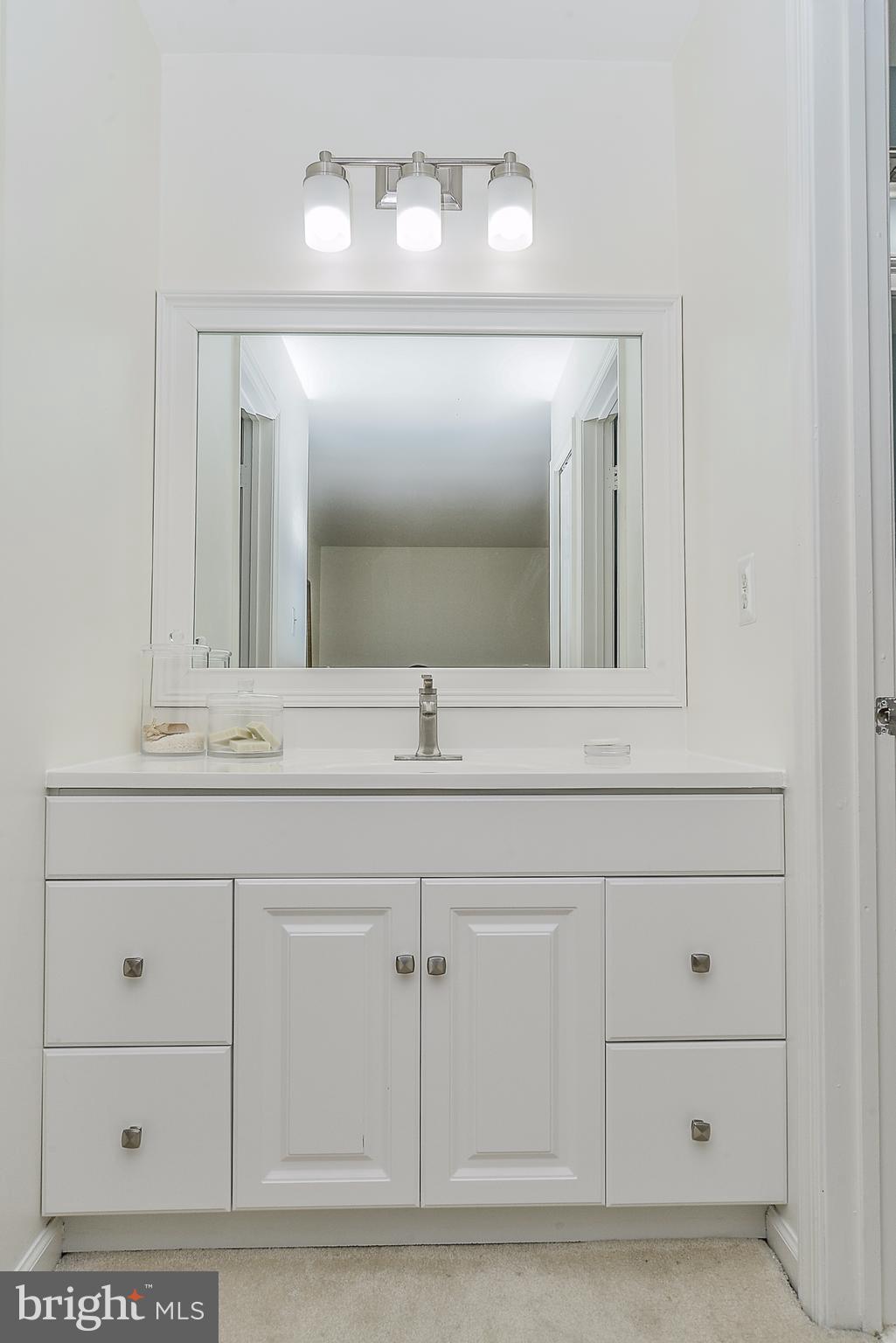7124 Hamor Lane Springfield, VA 22153 - Photo 21 of 30 New cabinet, vanity, faucet, lights
