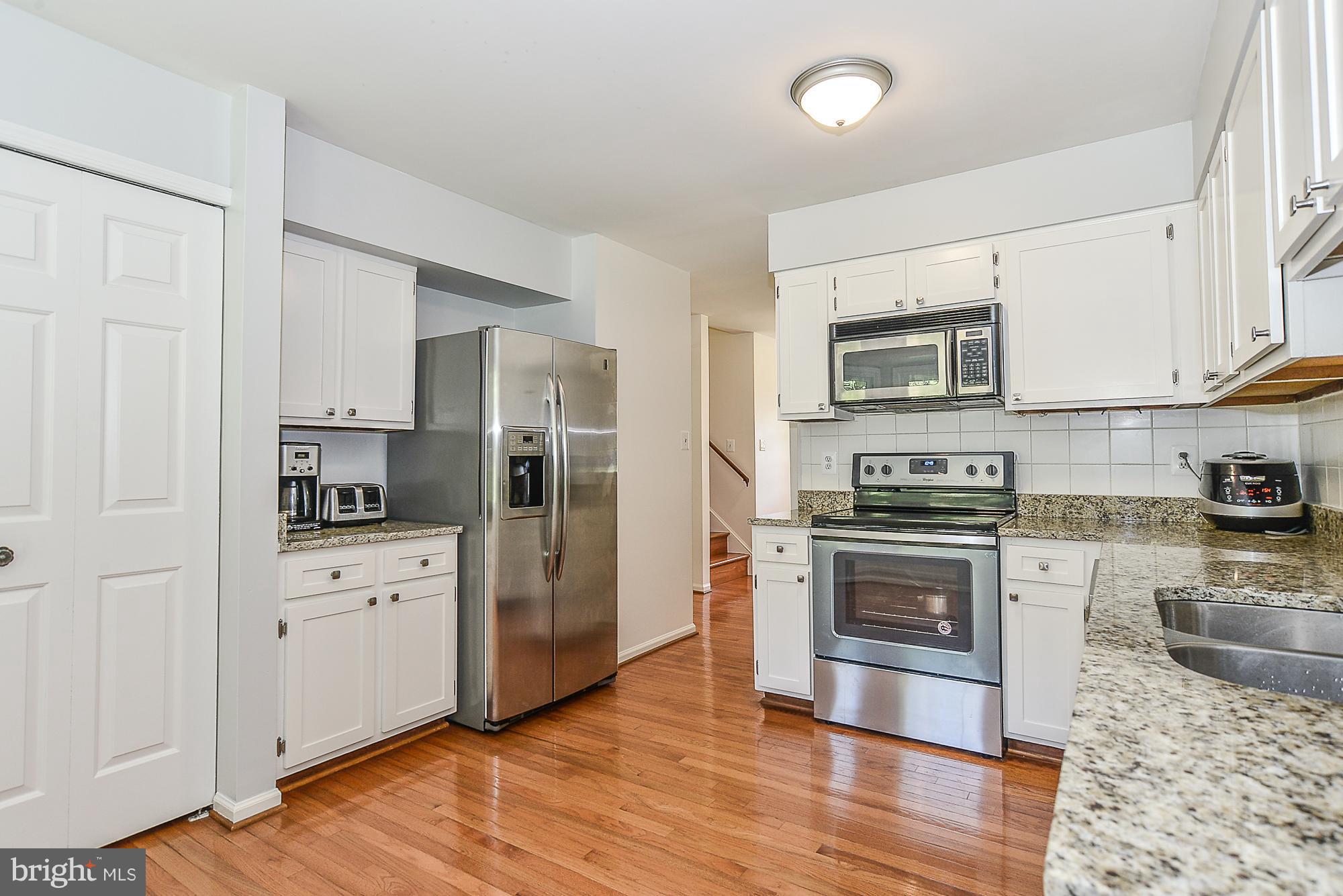 7124 Hamor Lane Springfield, VA 22153 - Photo 10 of 30 New granite countertop, refinished cabinets
