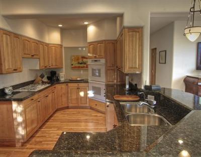 25 Andorra Road Edwards, CO 81632 - Photo 12 of 17 a kitchen with kitchen island granite countertop a sink and counter space