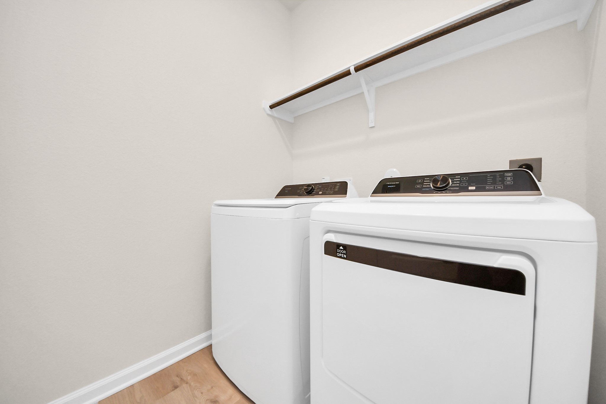 15523 Fathom Line Way Houston, TX 77053 - Photo 29 of 39 Convenient laundry room with built-in shelving for additional storage. Washer and dryer are included, providing added value and everyday convenience.