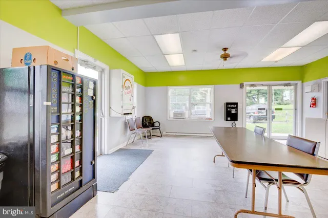 a kitchen with stainless steel appliances granite countertop a refrigerator a sink and a stove