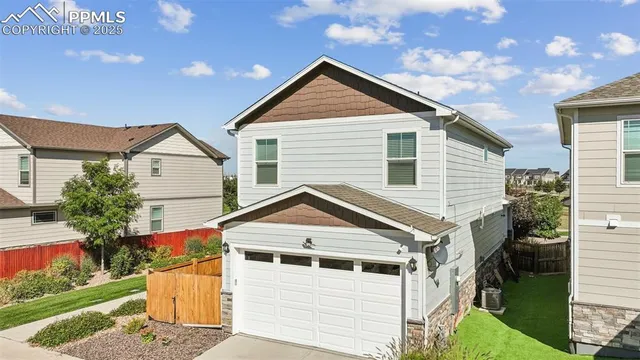 a view of house with a yard