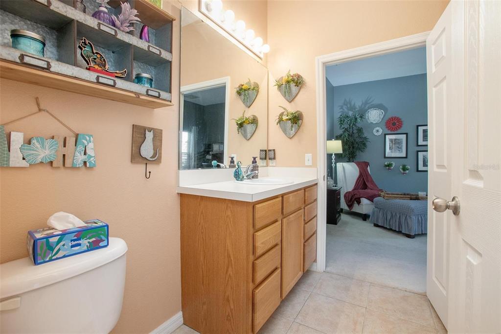970 North Spring Garden Avenue, Unit 311 Deland, FL 32720 - Photo 15 of 23 a bathroom with a sink mirror vanity and toilet