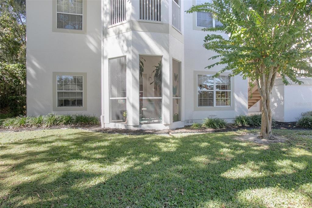 970 North Spring Garden Avenue, Unit 311 Deland, FL 32720 - Photo 23 of 23 a backyard of a house with yard and outdoor seating