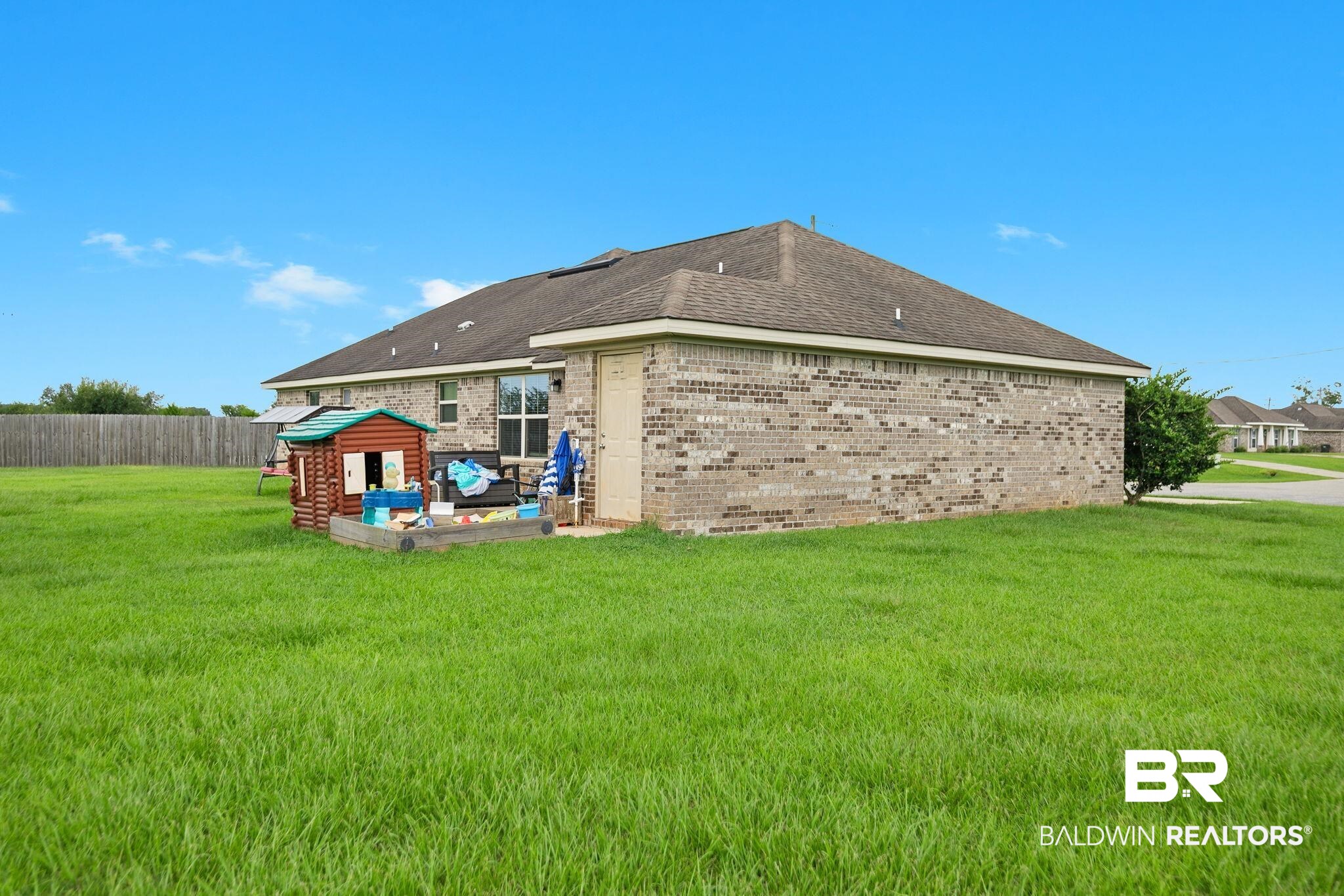 15573 Talus Court Foley, AL 36535 - Photo 35 of 50 Rear view of property featuring a patio and a lawn