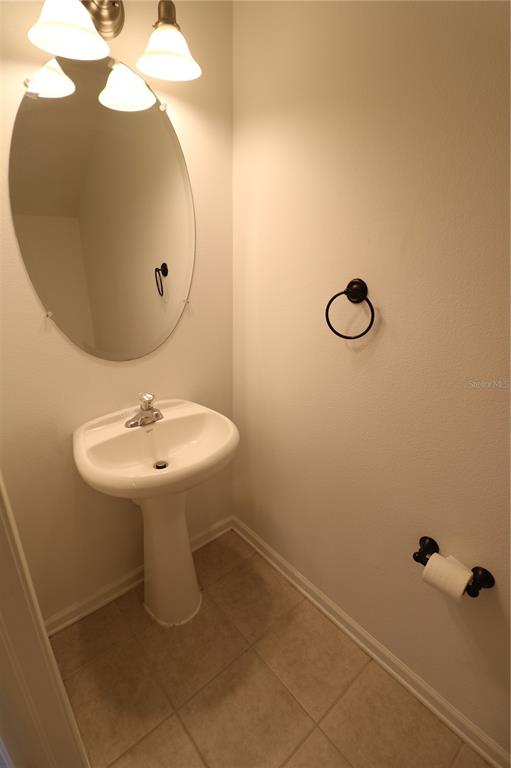 4866 Pond Ridge Drive Riverview, FL 33578 - Photo 19 of 38 a bathroom with a sink and mirror