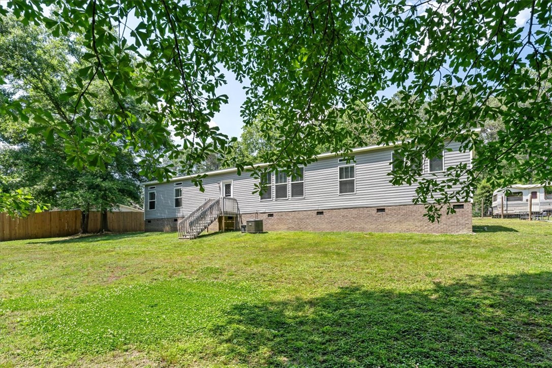 116 Parkview Road Iva, SC 29655 - Photo 39 of 44 An inviting backyard oasis offers ample green space and shade, perfect for outdoor activities.