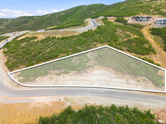 1845 East Outlaw Road, Unit 352 Hideout, UT 84036 - Photo 5 of 12 Sloped lot with existing vegetation and a paved road frontage