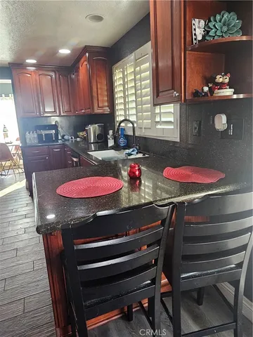 a kitchen with cabinets and appliances