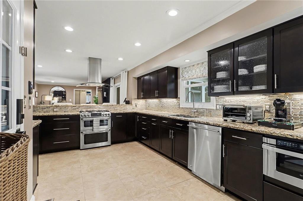1873 Queens Way Atlanta, GA 30341 - Photo 17 of 56 a large kitchen with stainless steel appliances and a stove top oven
