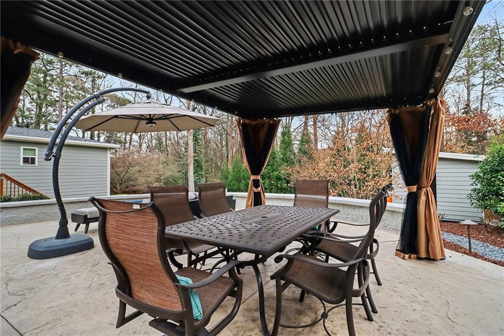 1873 Queens Way Atlanta, GA 30341 - Photo 45 of 56 a view of an outdoor sitting area with furniture and wooden deck