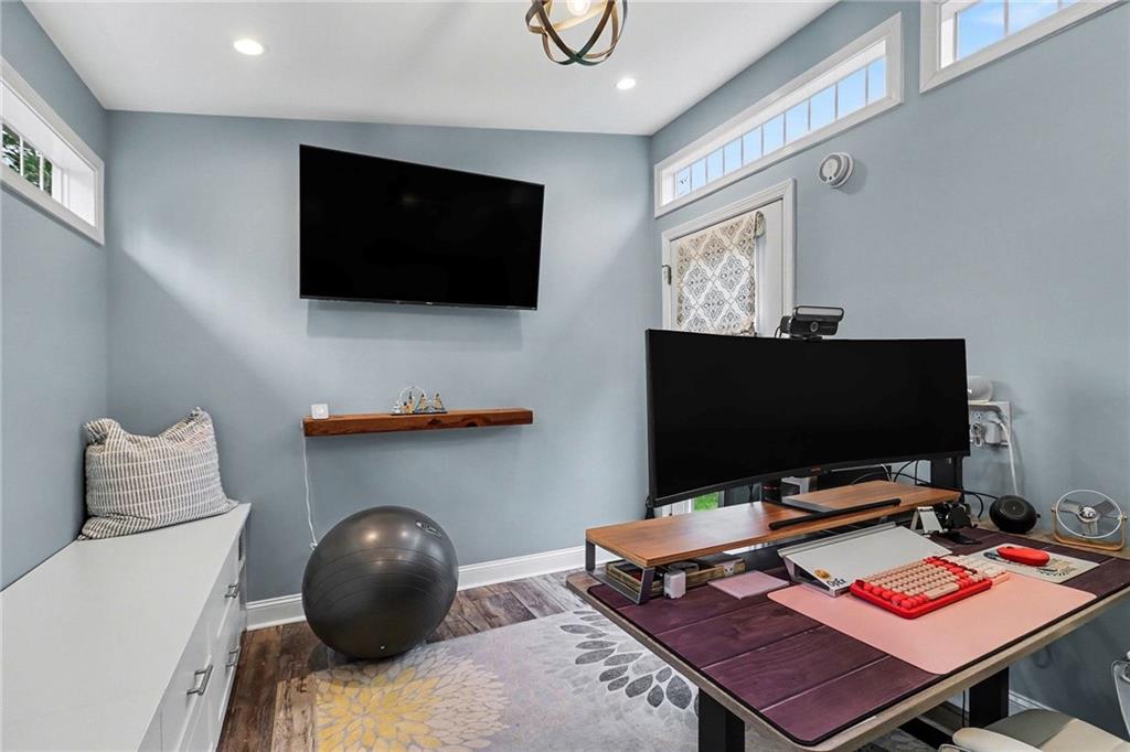 1873 Queens Way Atlanta, GA 30341 - Photo 53 of 56 a living room with a flat screen tv and a table
