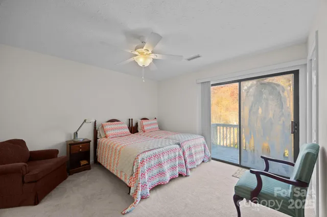 a bedroom with a bed furniture and a window