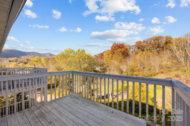 a view of a balcony with wooden floor