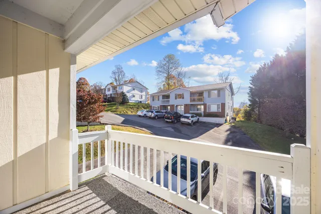 a view of a balcony with furniture