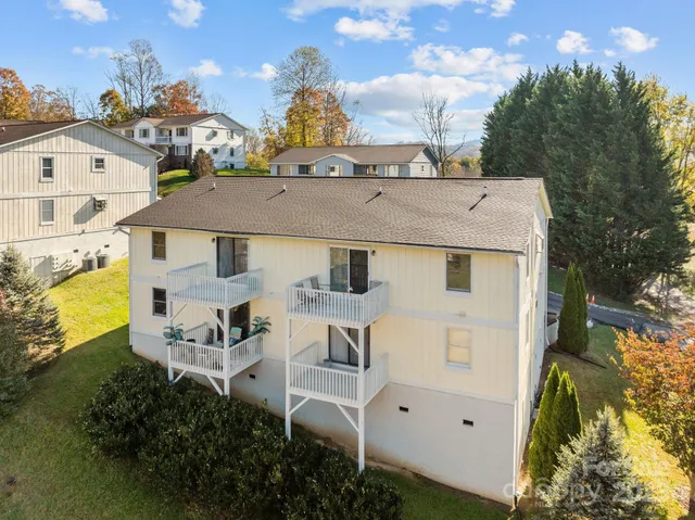 a aerial view of a house with table and chairs