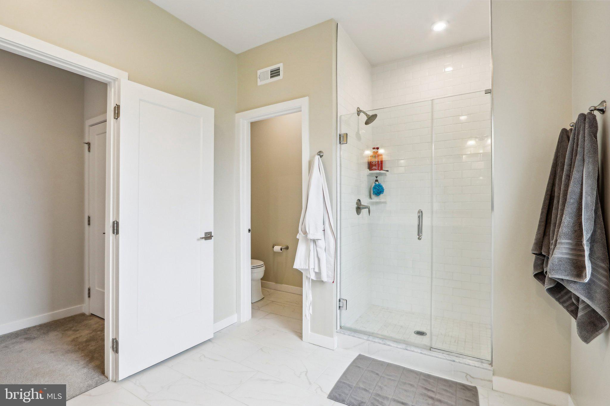 3174 Wier Drive East, Unit E Warrington, PA 18976 - Photo 24 of 37 a bathroom with a shower and a glass door