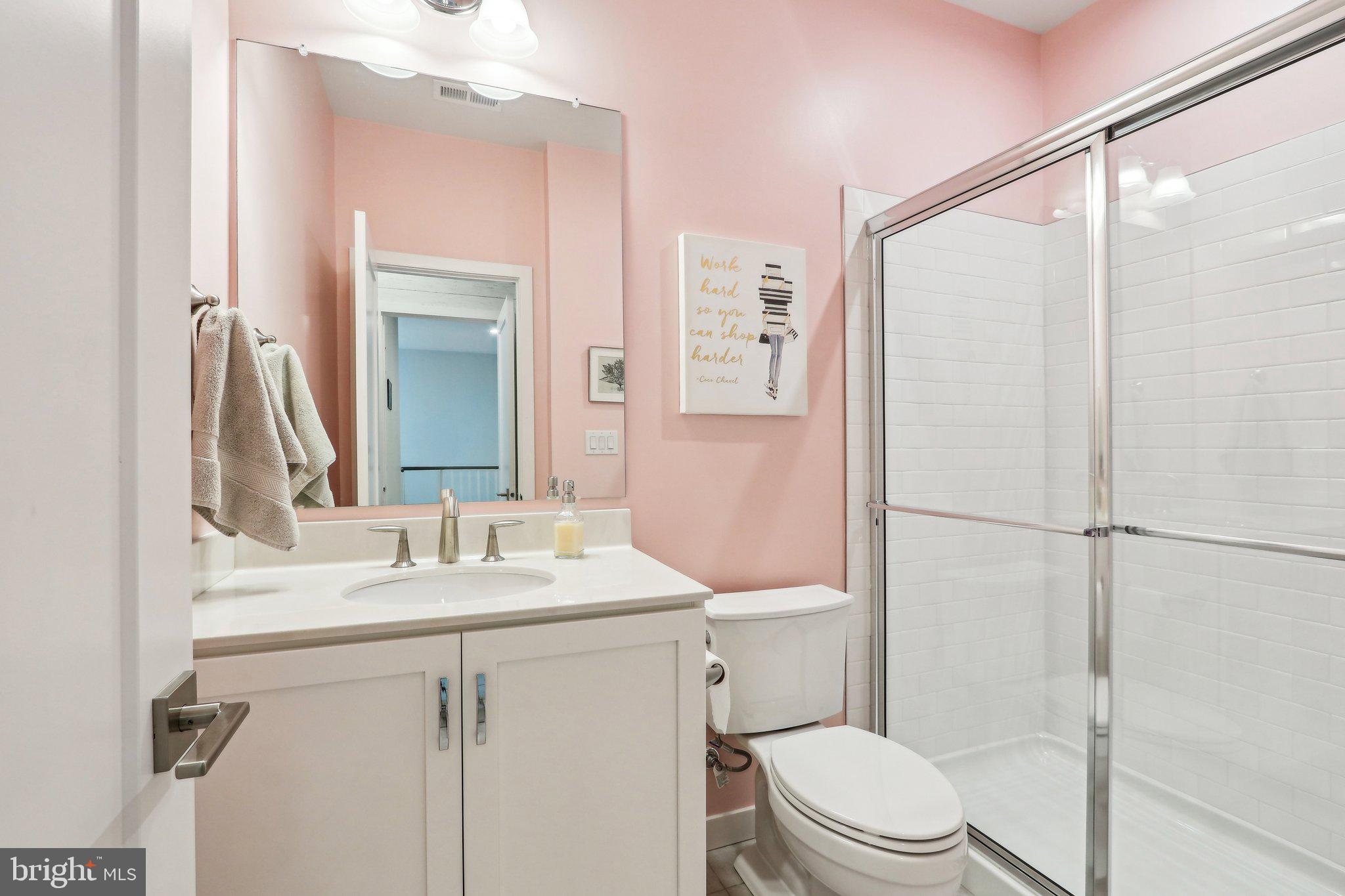 3174 Wier Drive East, Unit E Warrington, PA 18976 - Photo 30 of 37 a bathroom with a sink vanity mirror and toilet