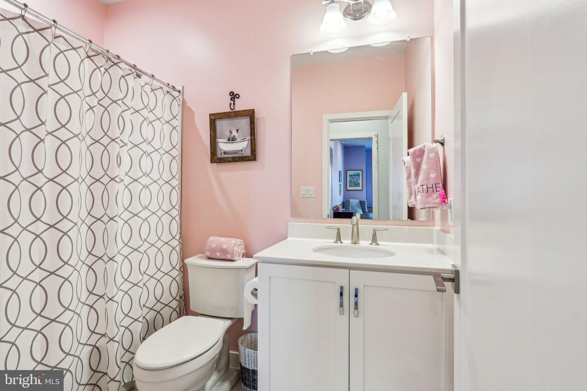 3174 Wier Drive East, Unit E Warrington, PA 18976 - Photo 33 of 37 a bathroom with a sink vanity mirror and toilet